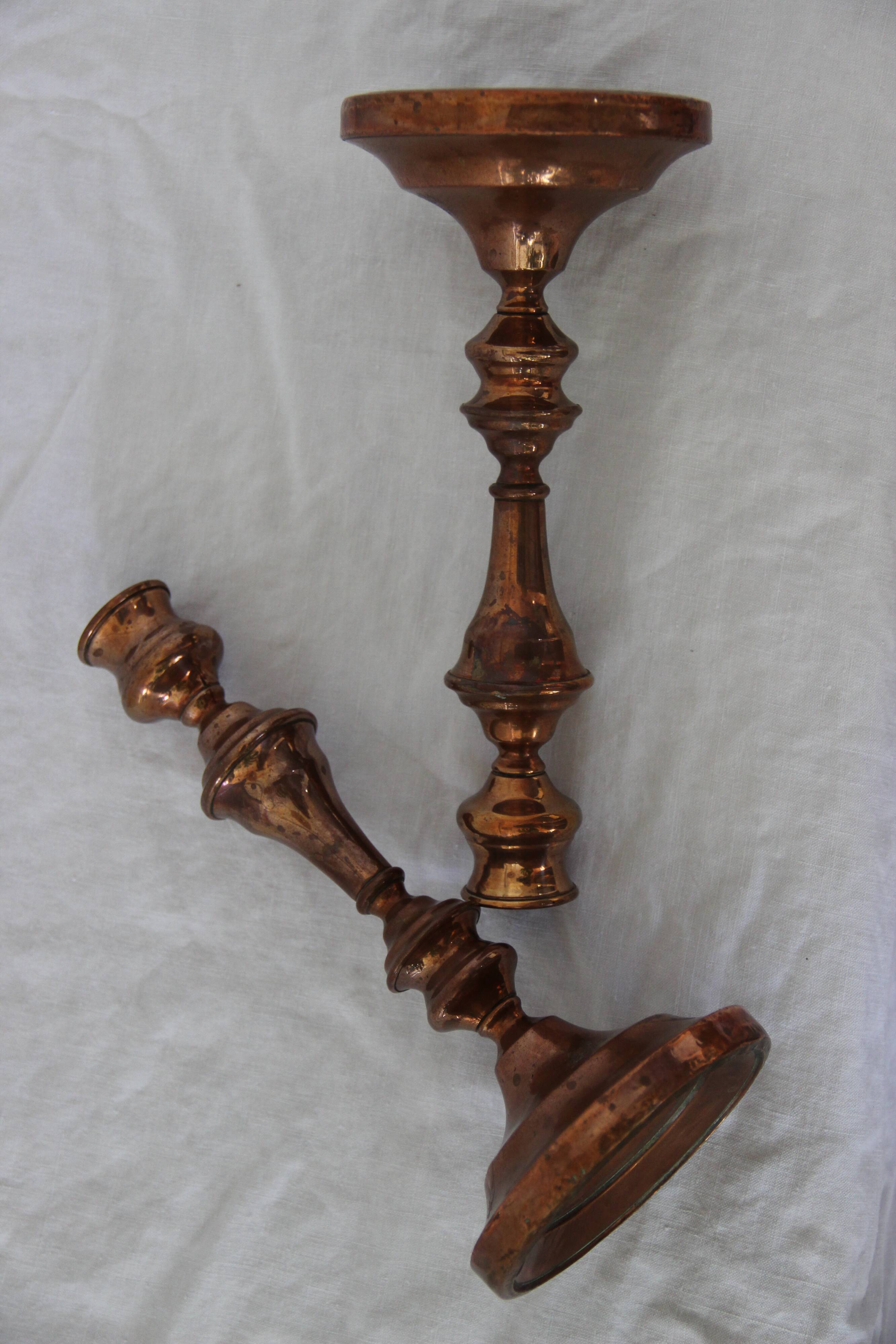 Two copper candle holders