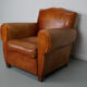 Vintage french moustache back cognac-colored leather club chair