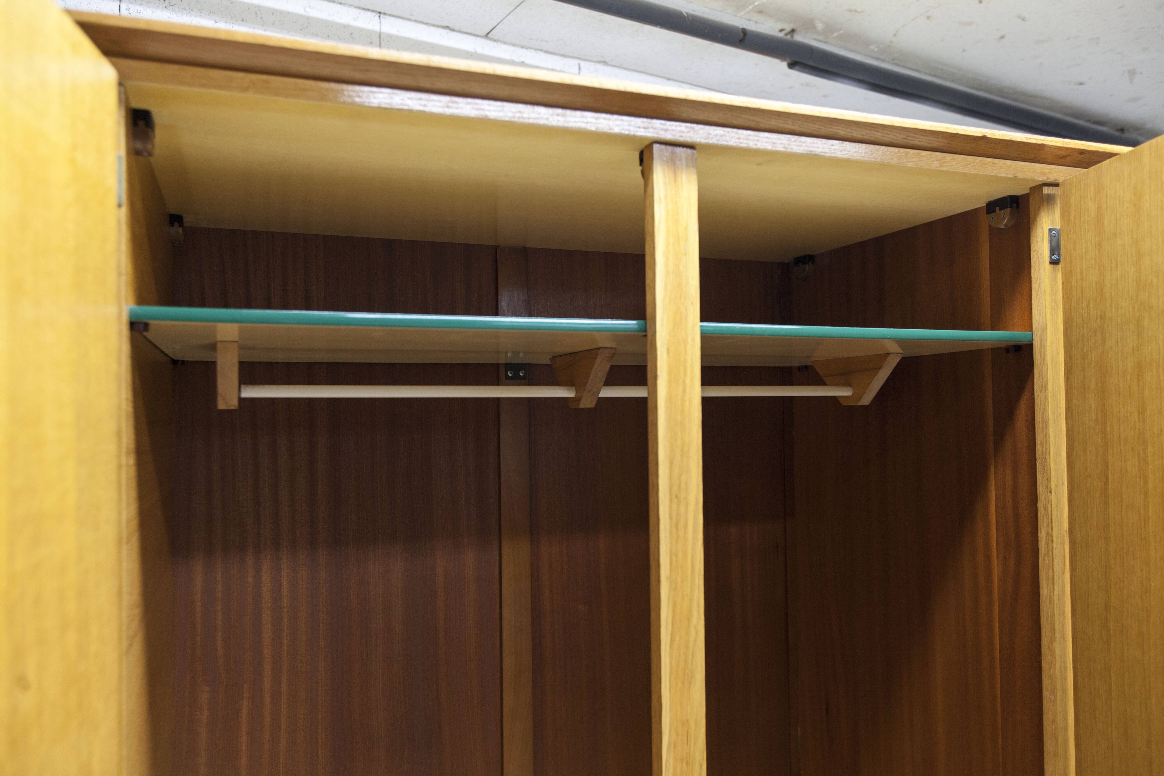 French wardrobe with tapered legs, 3 doors, 1 mirror (27*130), and 1 drawer.