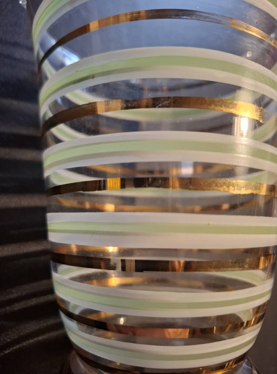 Vintage vase with green and gold trim.