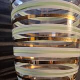 Vintage vase with green and gold trim.