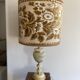 Antique table lamp in marble and tapestry