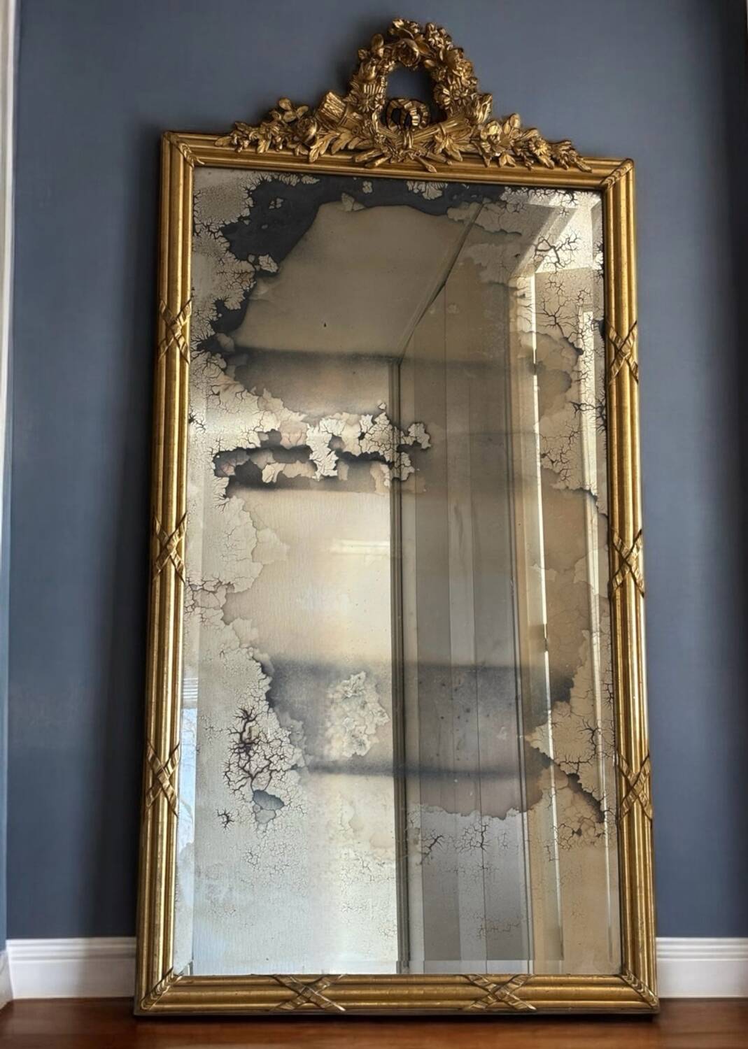 Large Louis XVI style gilded mirror, 19th century