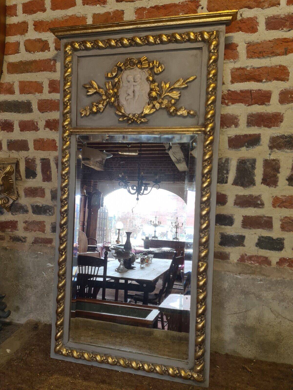 gray and gold patinated trumeau mirror