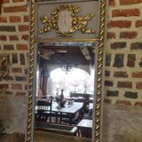 gray and gold patinated trumeau mirror
