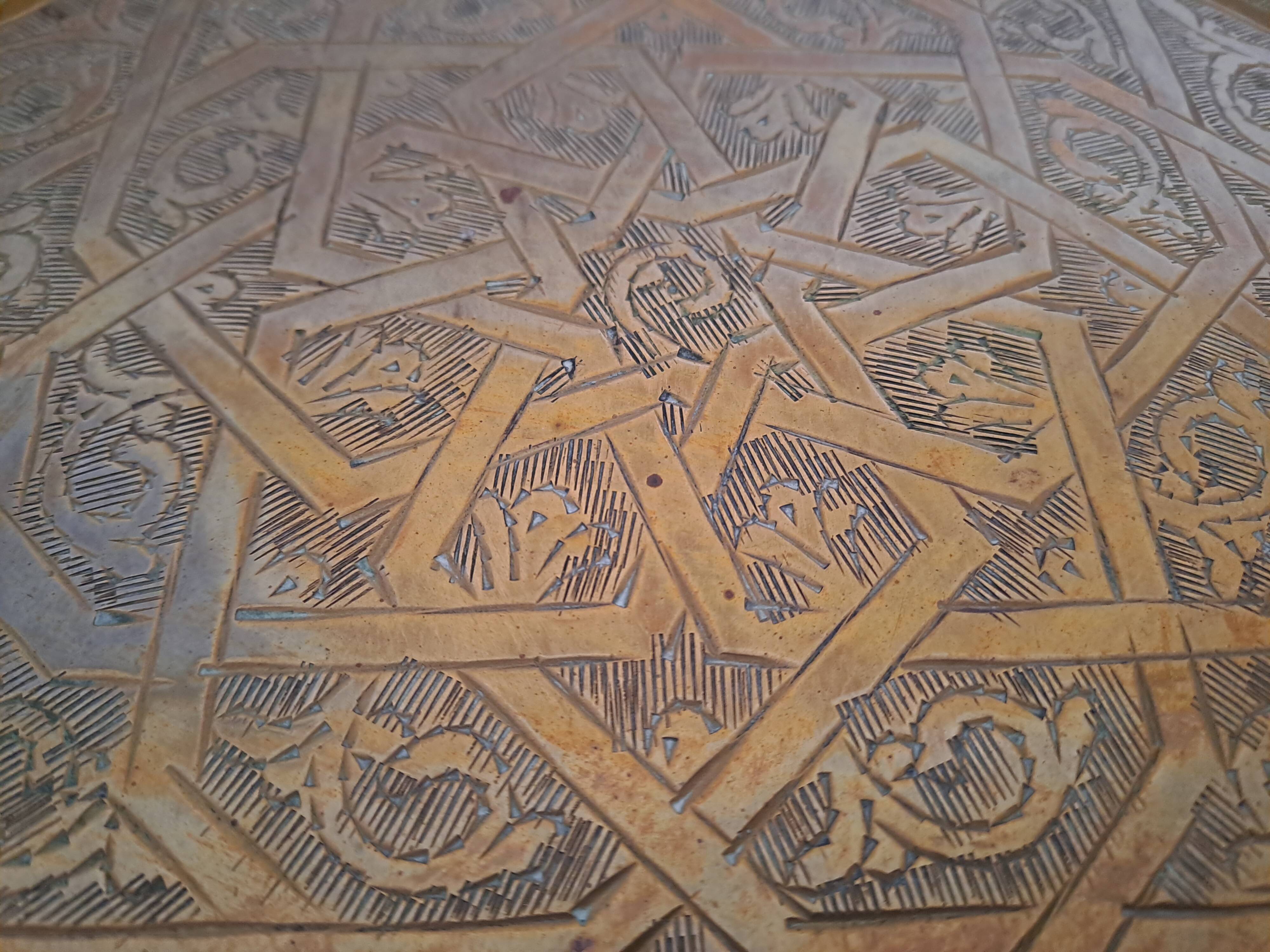 Large chiseled metal plate