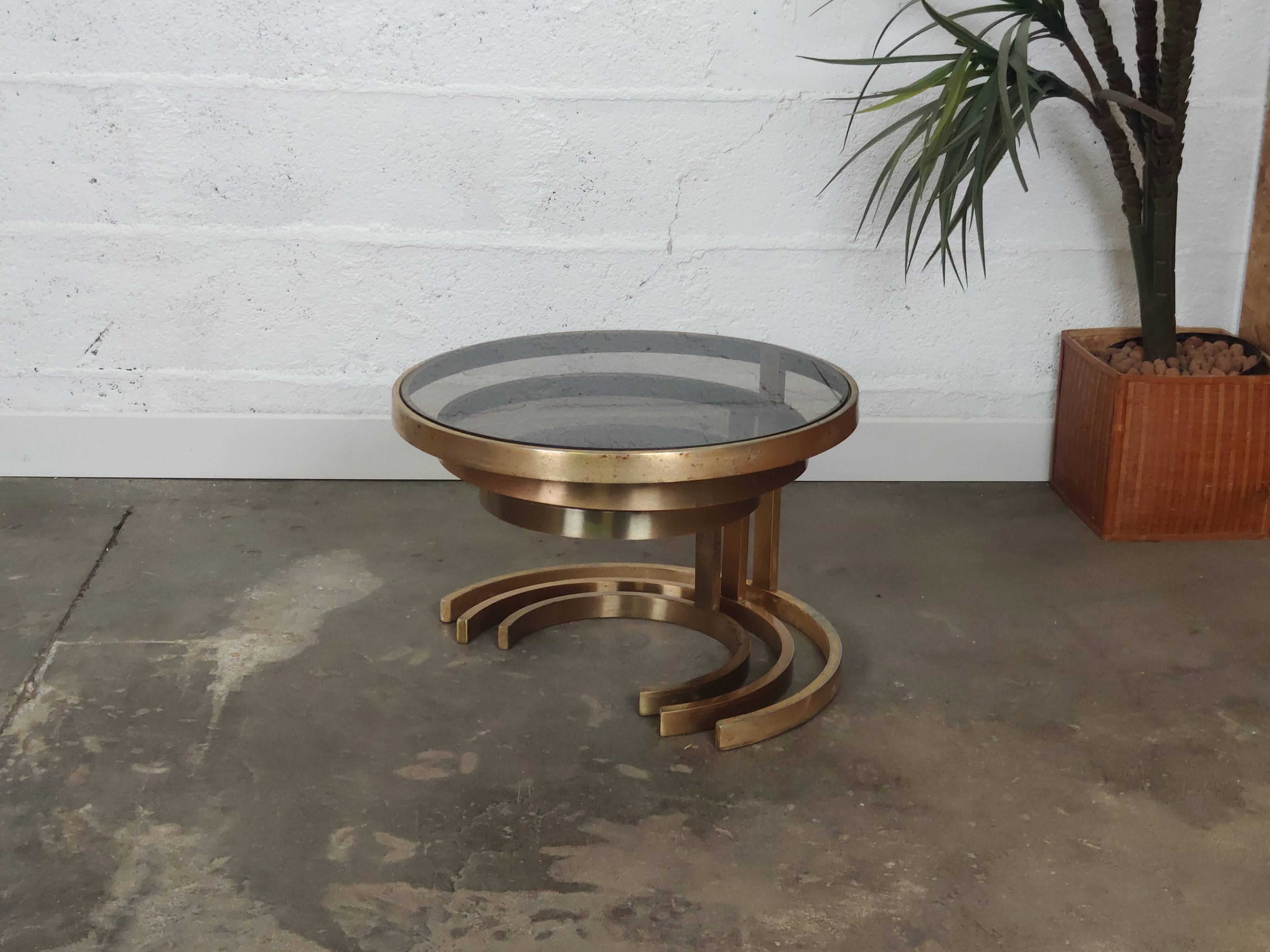 Superb trundle table round golden and smoked glass