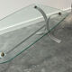 Design coffee table in brushed metal with a glass top, 1970s.