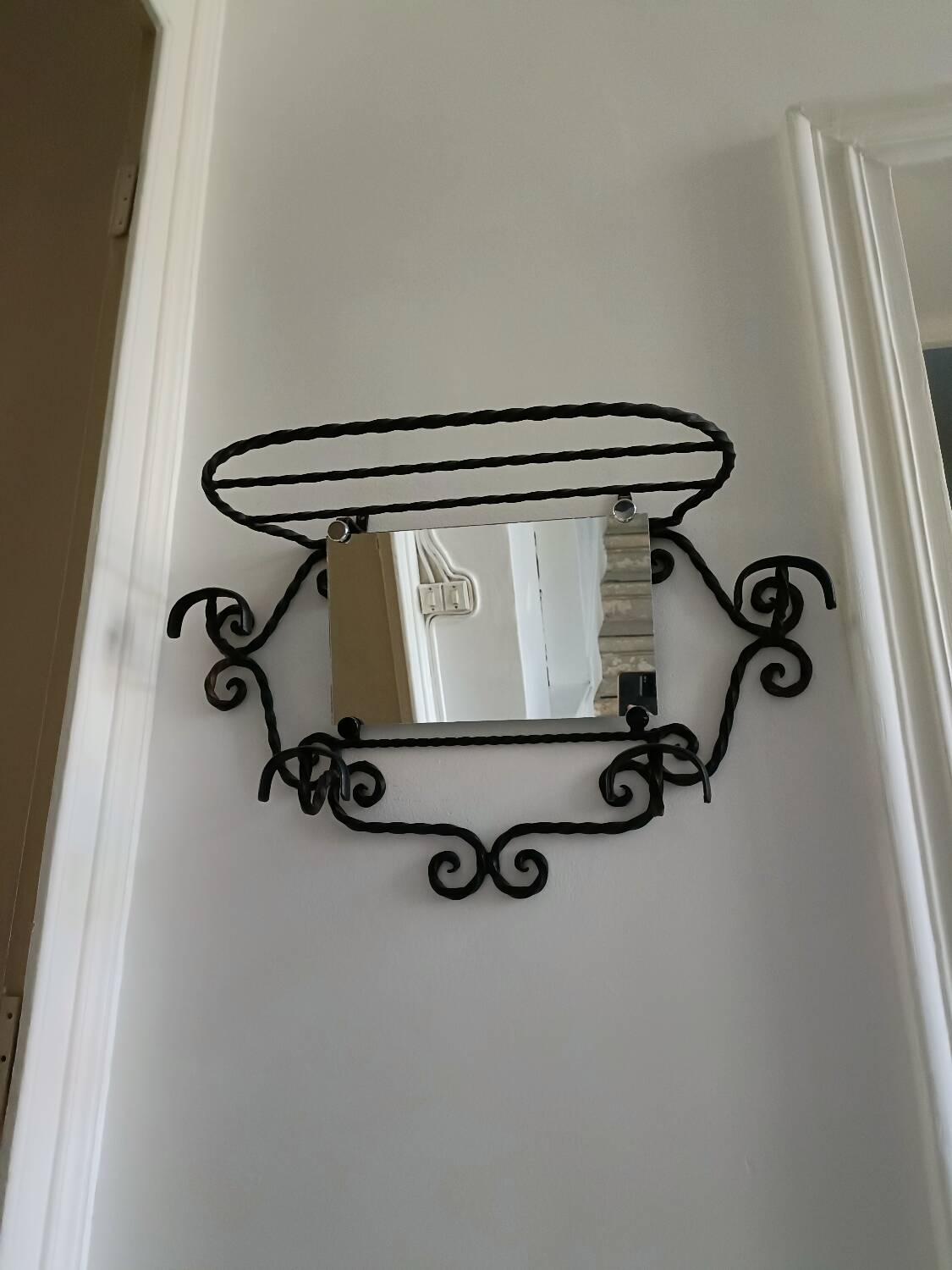 Twisted wrought iron wall-mounted coat rack