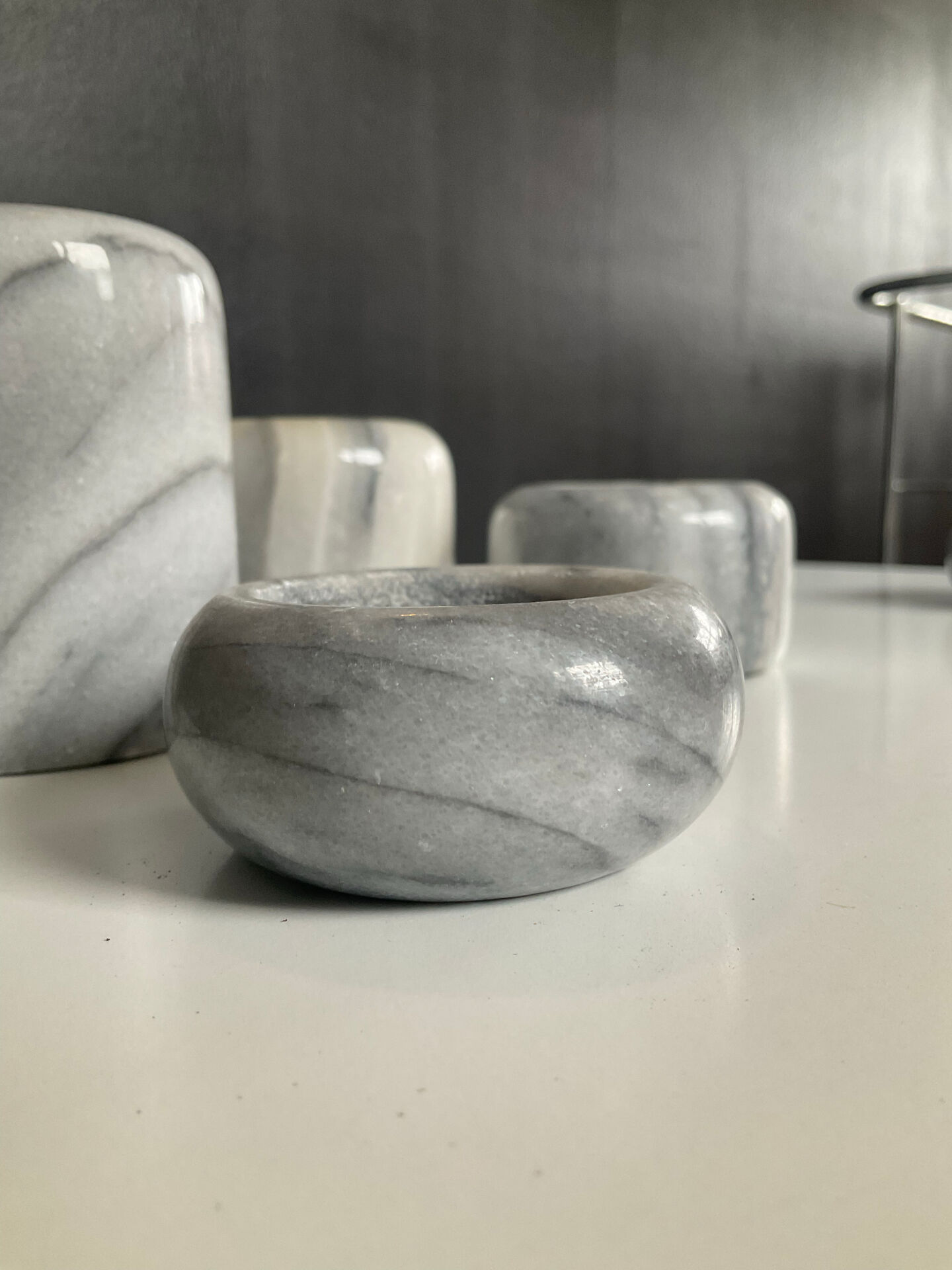 Set of 5 nesting candle holders in white marble.