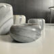 Set of 5 nesting candle holders in white marble.
