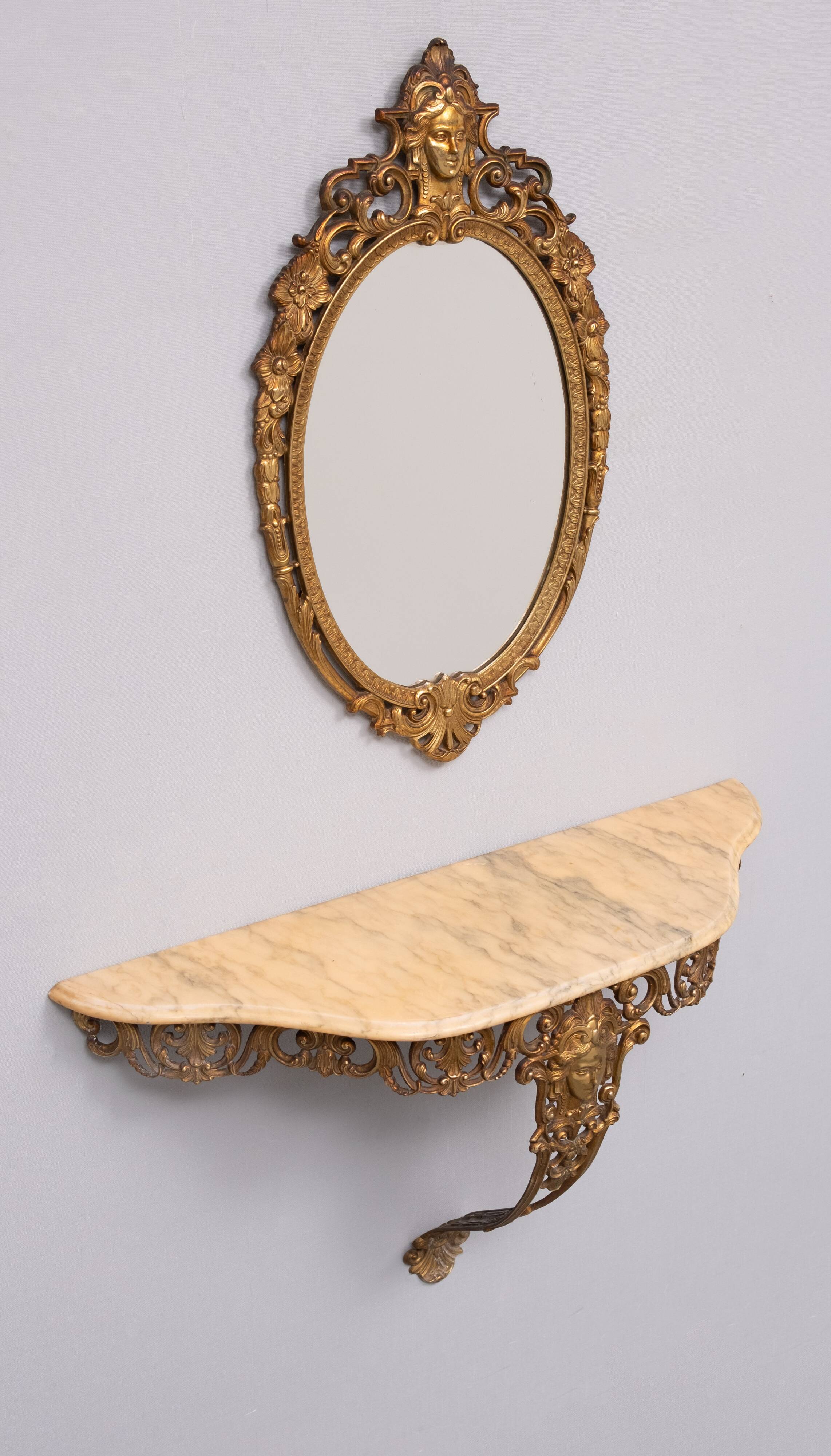 Classic gilded brass console with oval mirror from the 1950s, Italy.