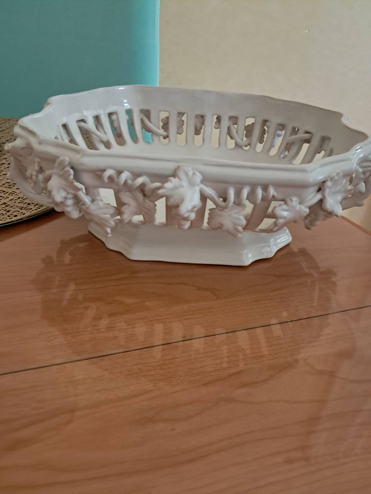Malicorne fruit bowl in white pierced faience with monogram TE.