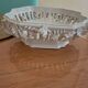 Malicorne fruit bowl in white pierced faience with monogram TE.