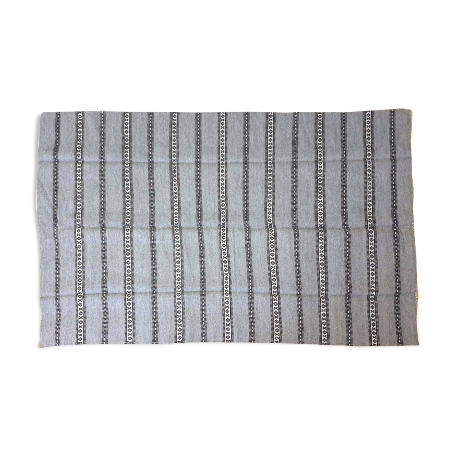 Handwoven vintage geometrical rug, grey background