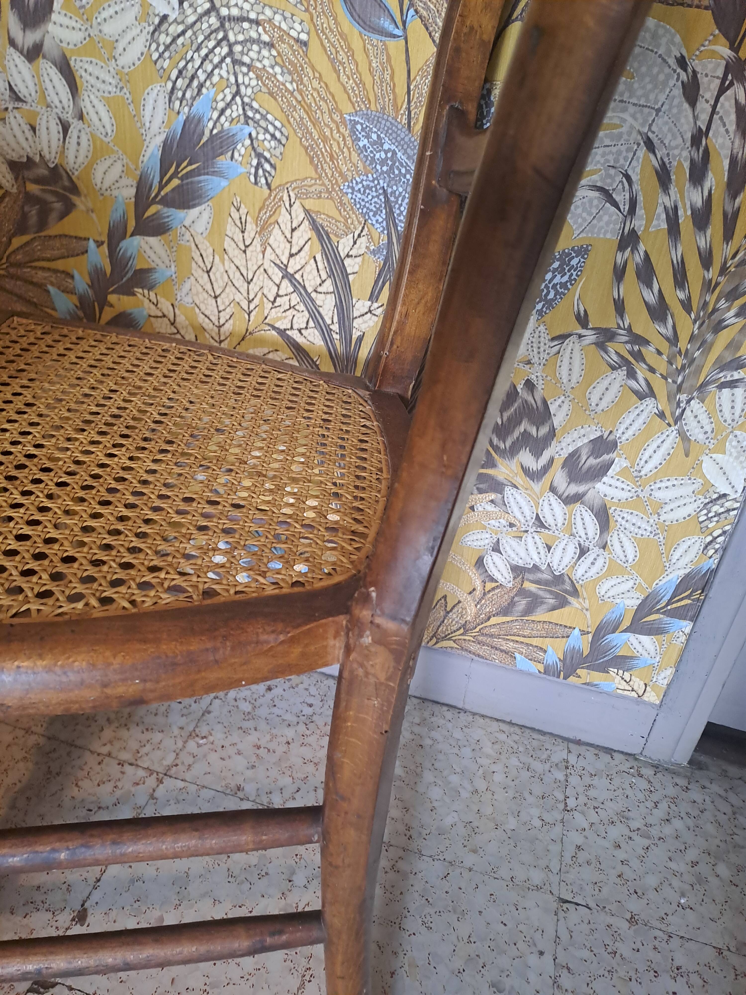 Pair of 1950s light wood bistro chairs with cane seats