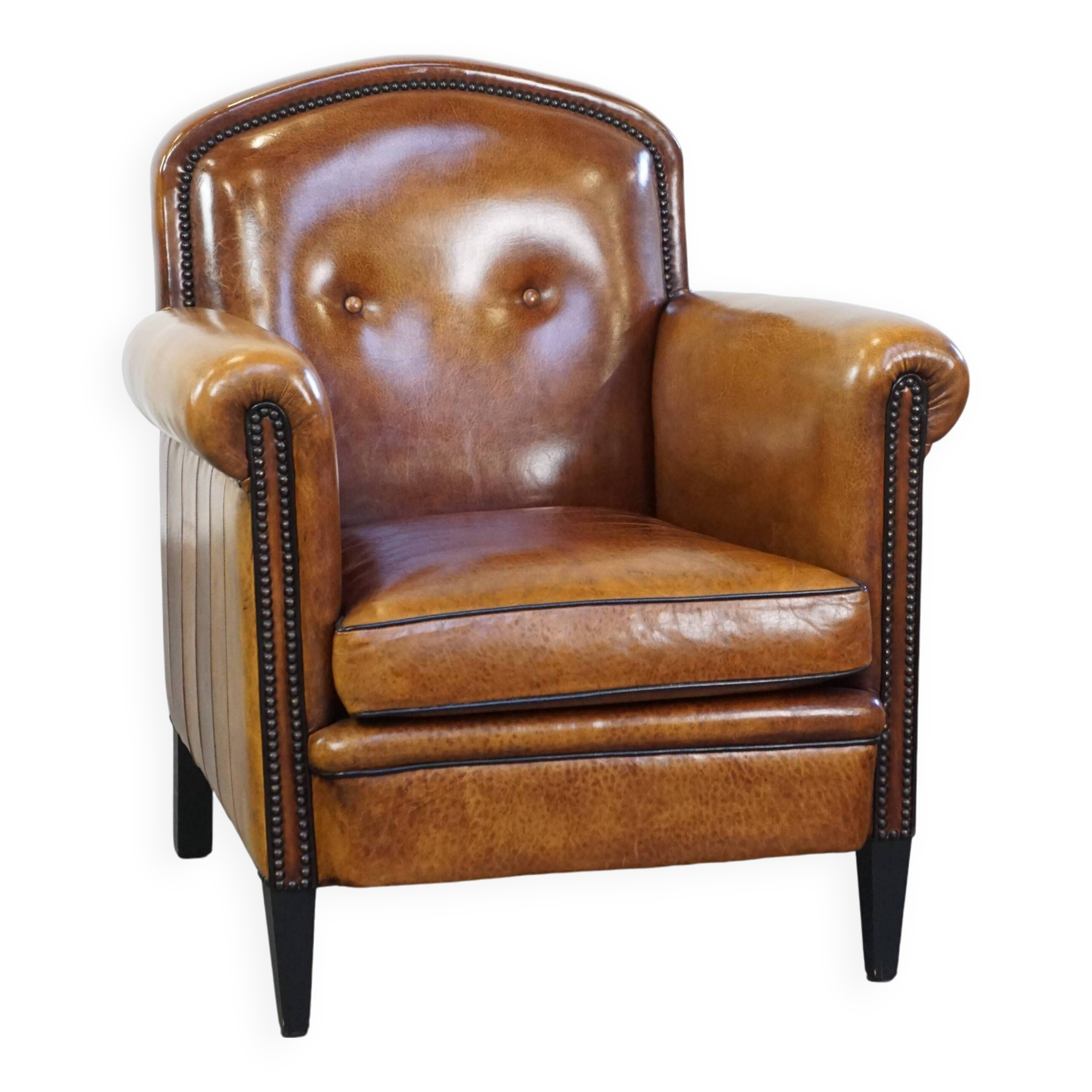 Sheep leather design armchair finished with decorative nails and black piping