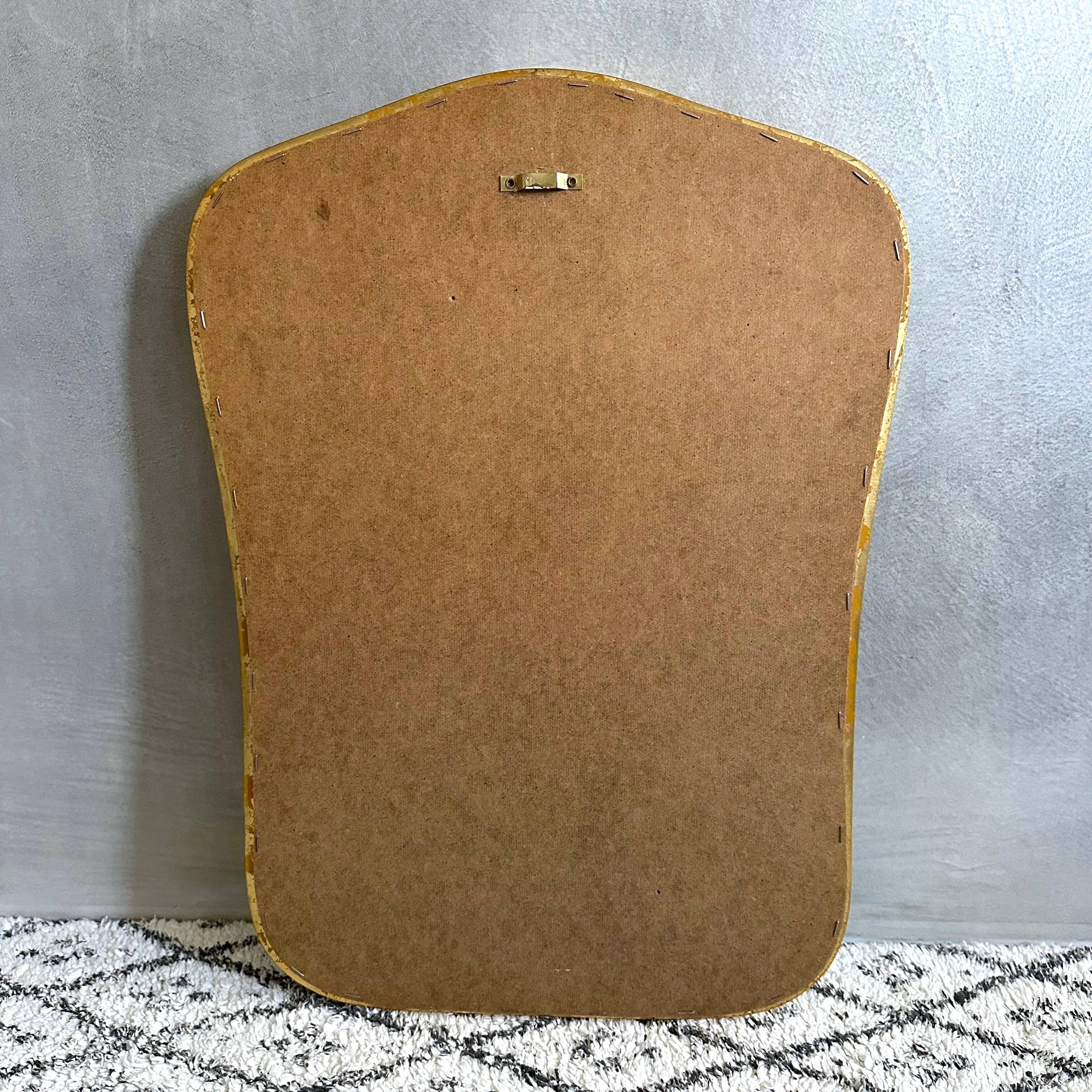 Vintage wall mirror with gold rim