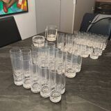 Set of 43 signed Daum crater glasses, an ice bucket, an ashtray,