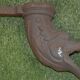 Cast iron gutter downspout in the shape of a dolphin