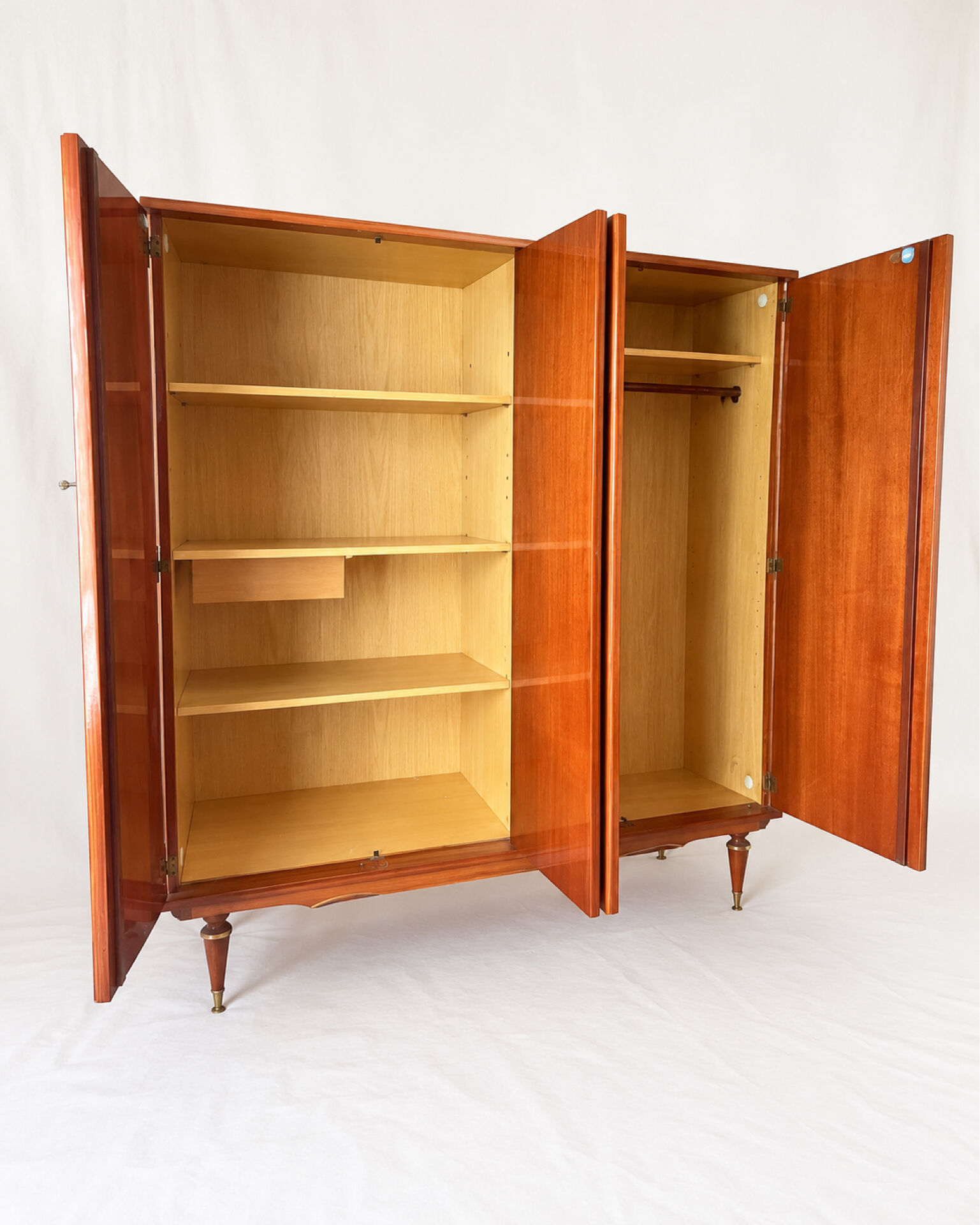 Vintage 1970s wardrobe with floral marquetry, mirrors, and gold details.