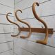 Curved wooden coat rack with 3 hooks, 1920s.