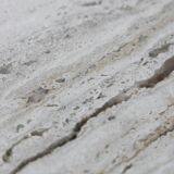 Circular travertine coffee table
