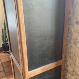Vintage wooden wardrobe with matte cast iron color hanging rail