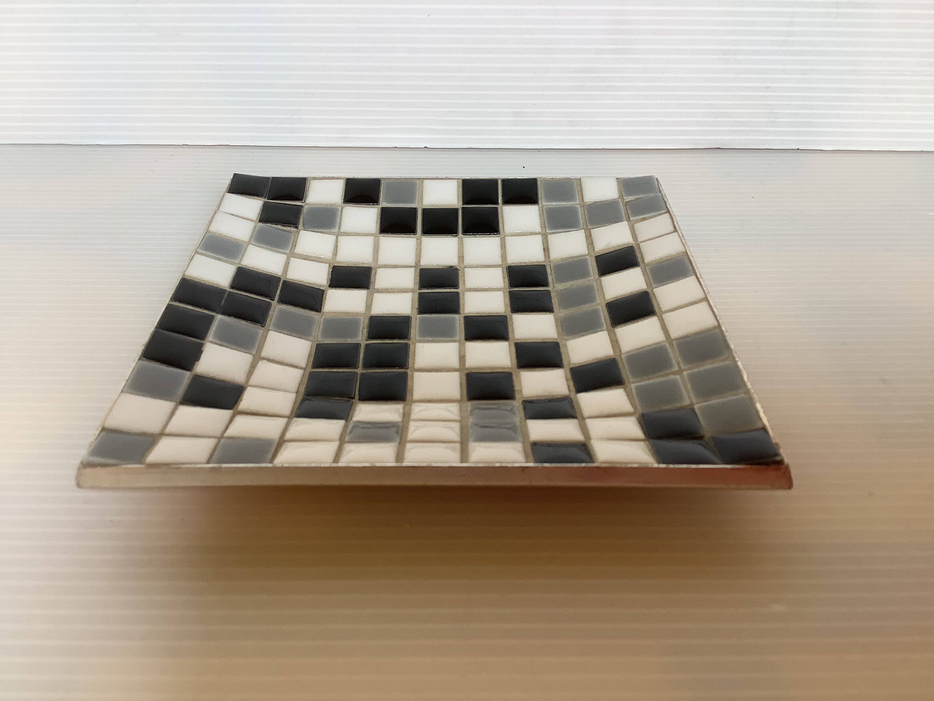Mosaic grey, white, and black catch-all tray.