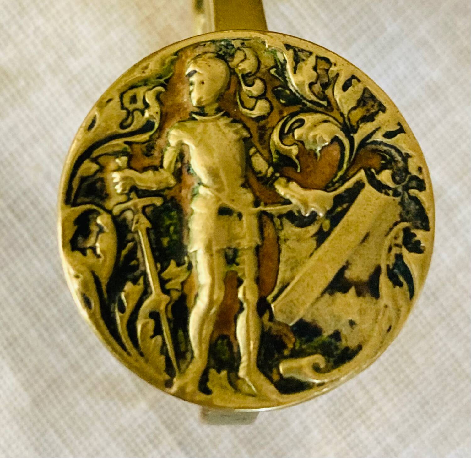 20th century chiseled brass socket candle holder representing Horsemen in armor