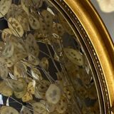 Oval-shaped gilded wooden mirror