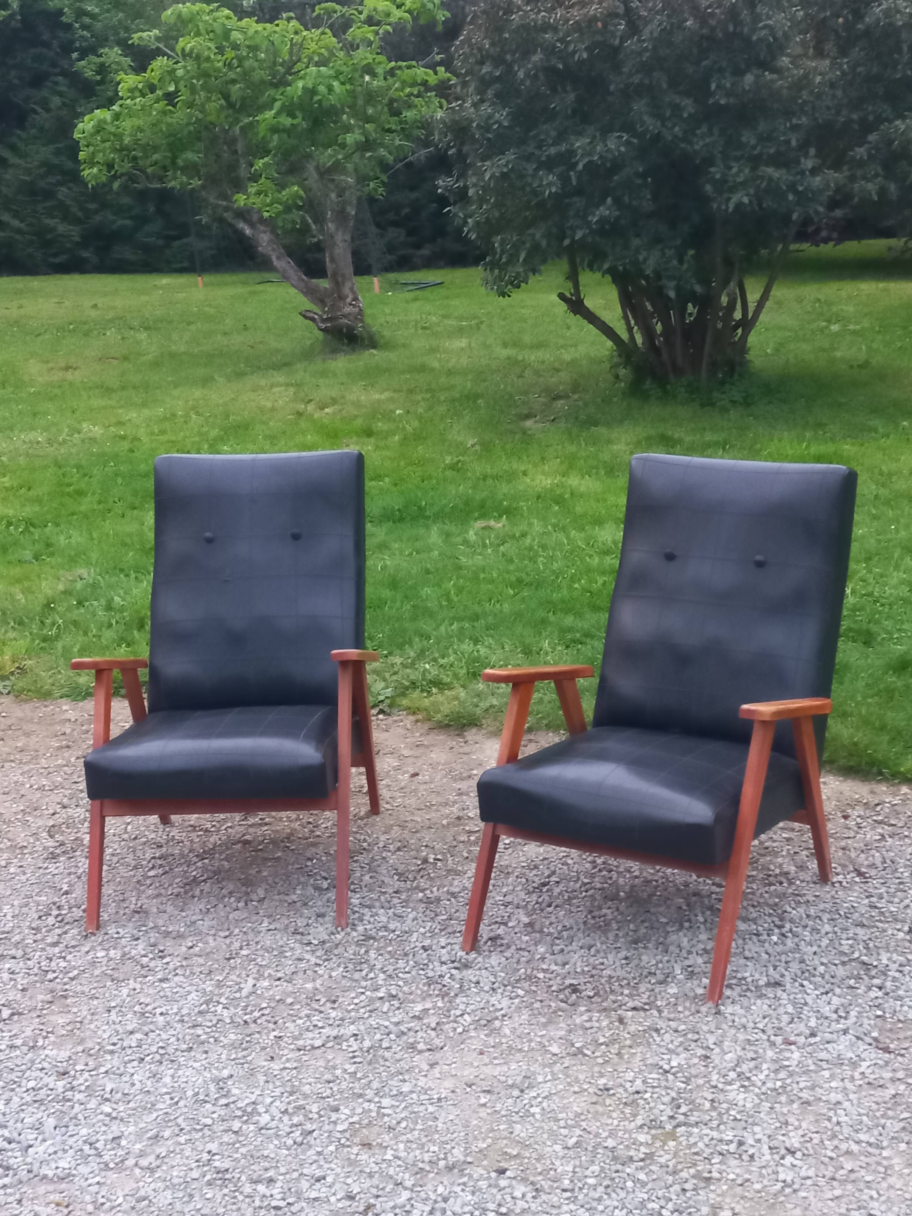 Pair of vintage beech armchairs feet compass covered with black moleskine from the 50s