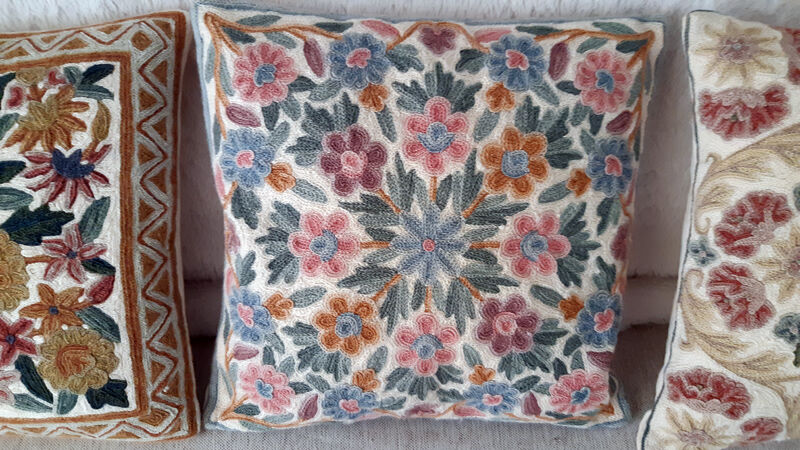Set of three old hand-embroidered wool cushions