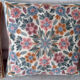 Set of three old hand-embroidered wool cushions
