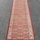 Long Persian rug in burgundy red wool with flowers, handmade 205x70