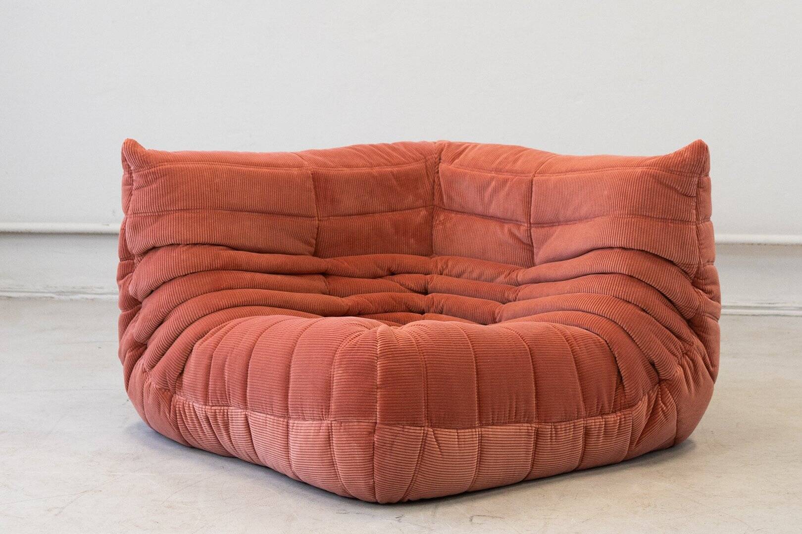 Coral corduroy Togo corner chair by Michel Ducaroy for Ligne Roset