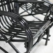 Pair of black lacquered rattan armchairs. France, cira 1960.