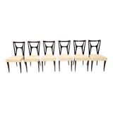 Ensemble de six chaises de salle à manger en hêtre noirci avec revêtement en skaï ivoire, Italie