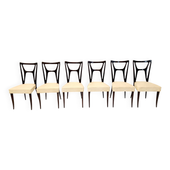 Ensemble de six chaises de salle à manger en hêtre noirci avec revêtement en skaï ivoire, Italie
