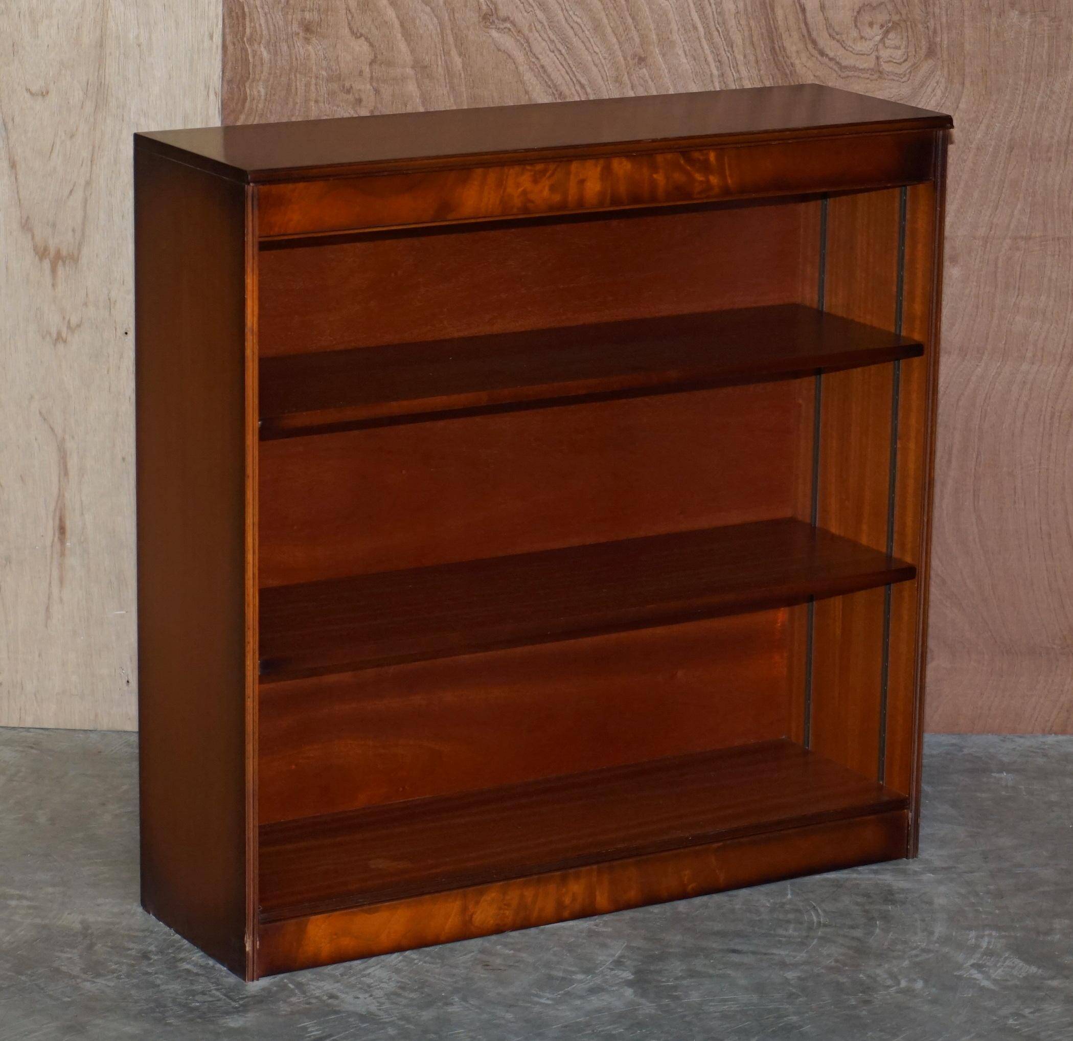 Pair of open dwarf bookshelves in mahogany by Shaws of London.