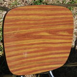 Pair of formica chairs with chrome metal backs in the shape of a lyre.
