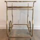 Neo-classical table in gilded metal and glass