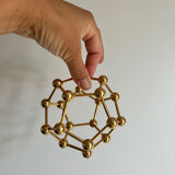 Golden brass atom