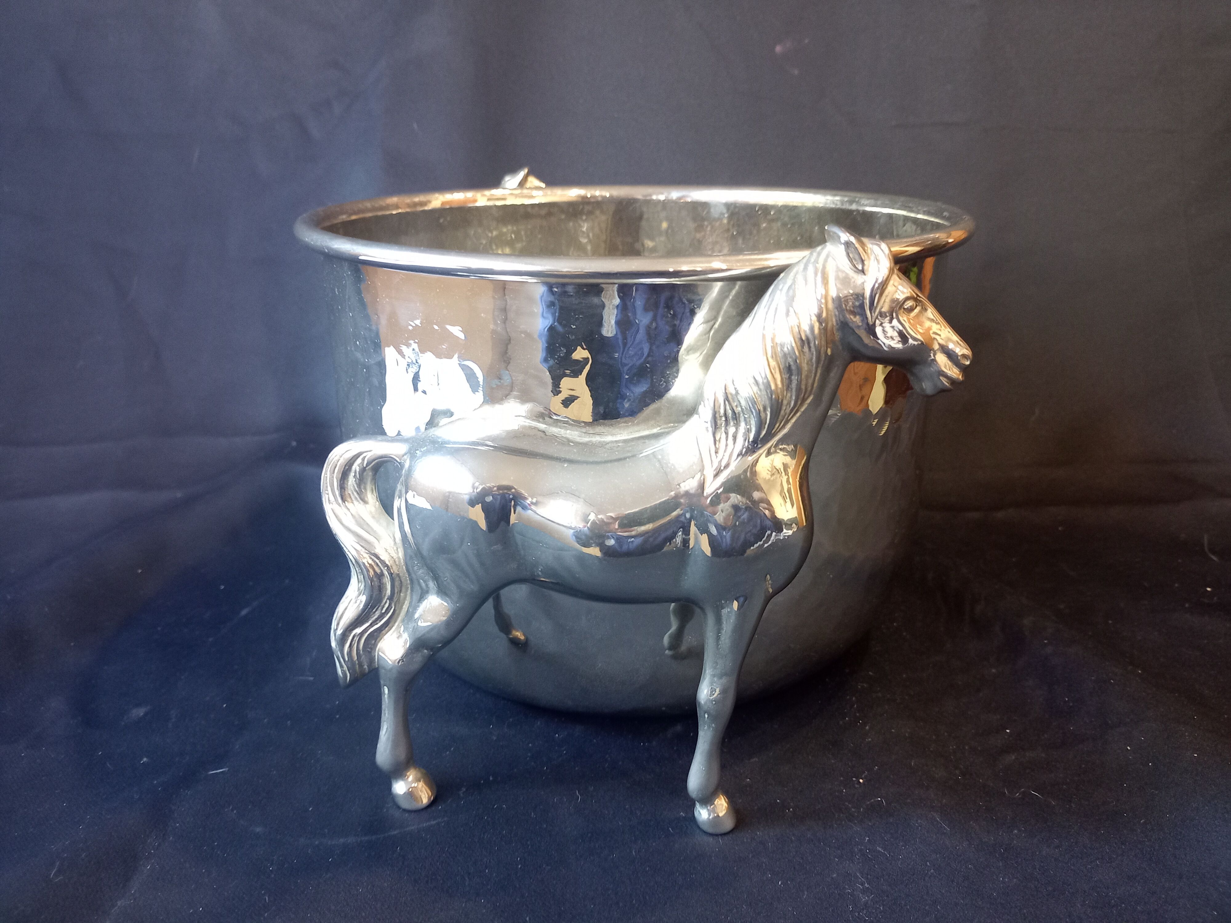 Bucket with decoration of horses