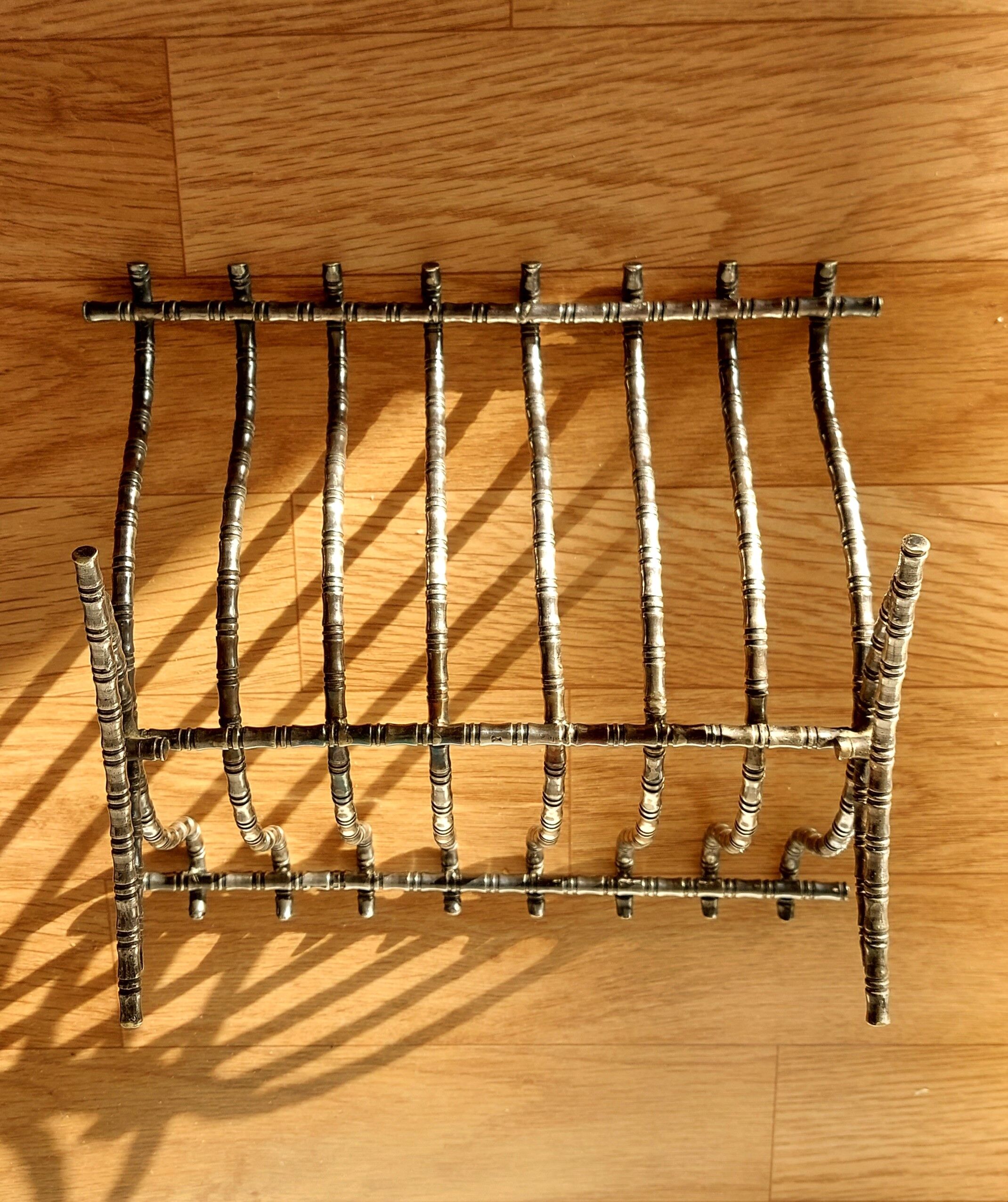 Silver metal cut in imitation of vintage bamboo.