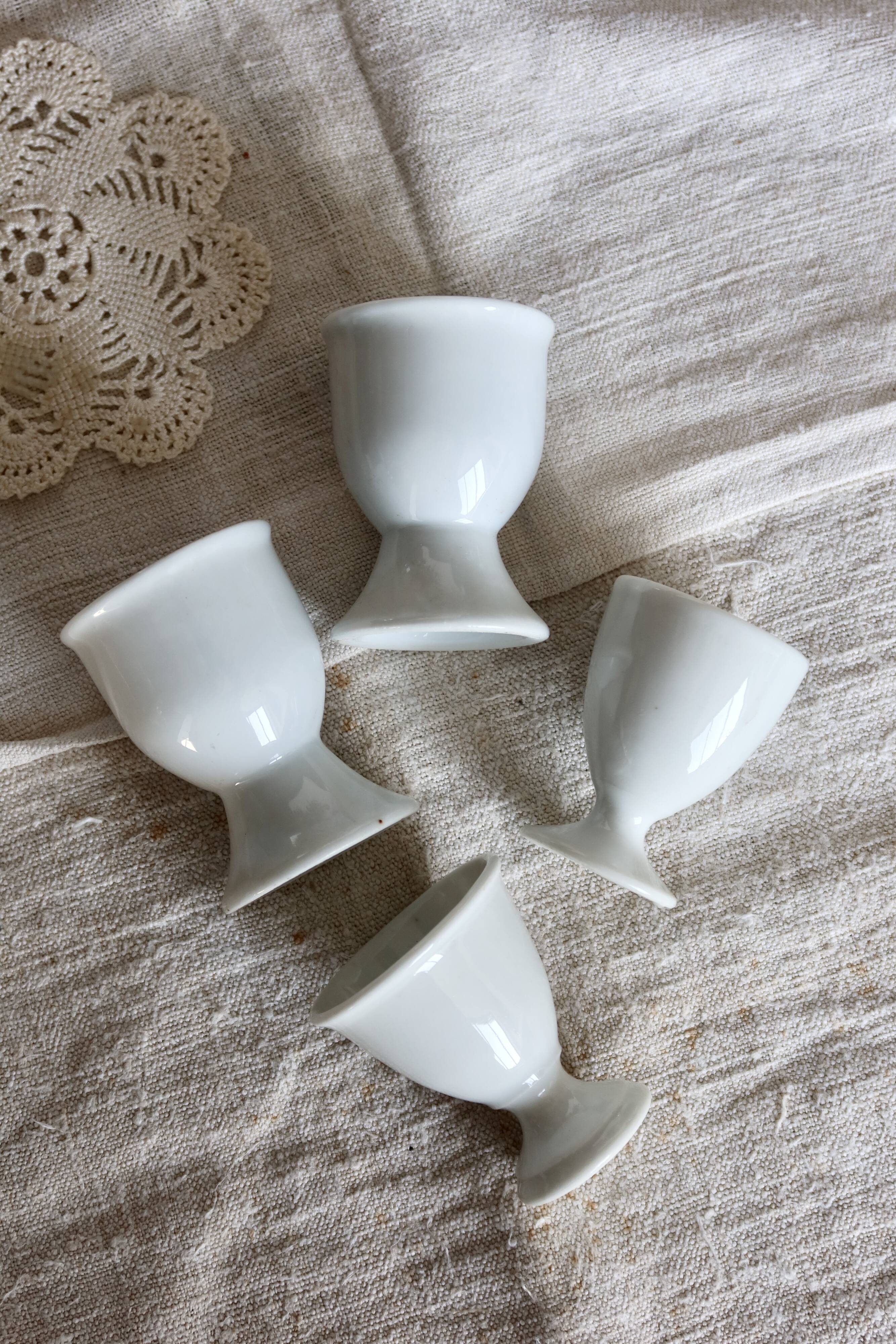 4 mismatched vintage white porcelain egg cups