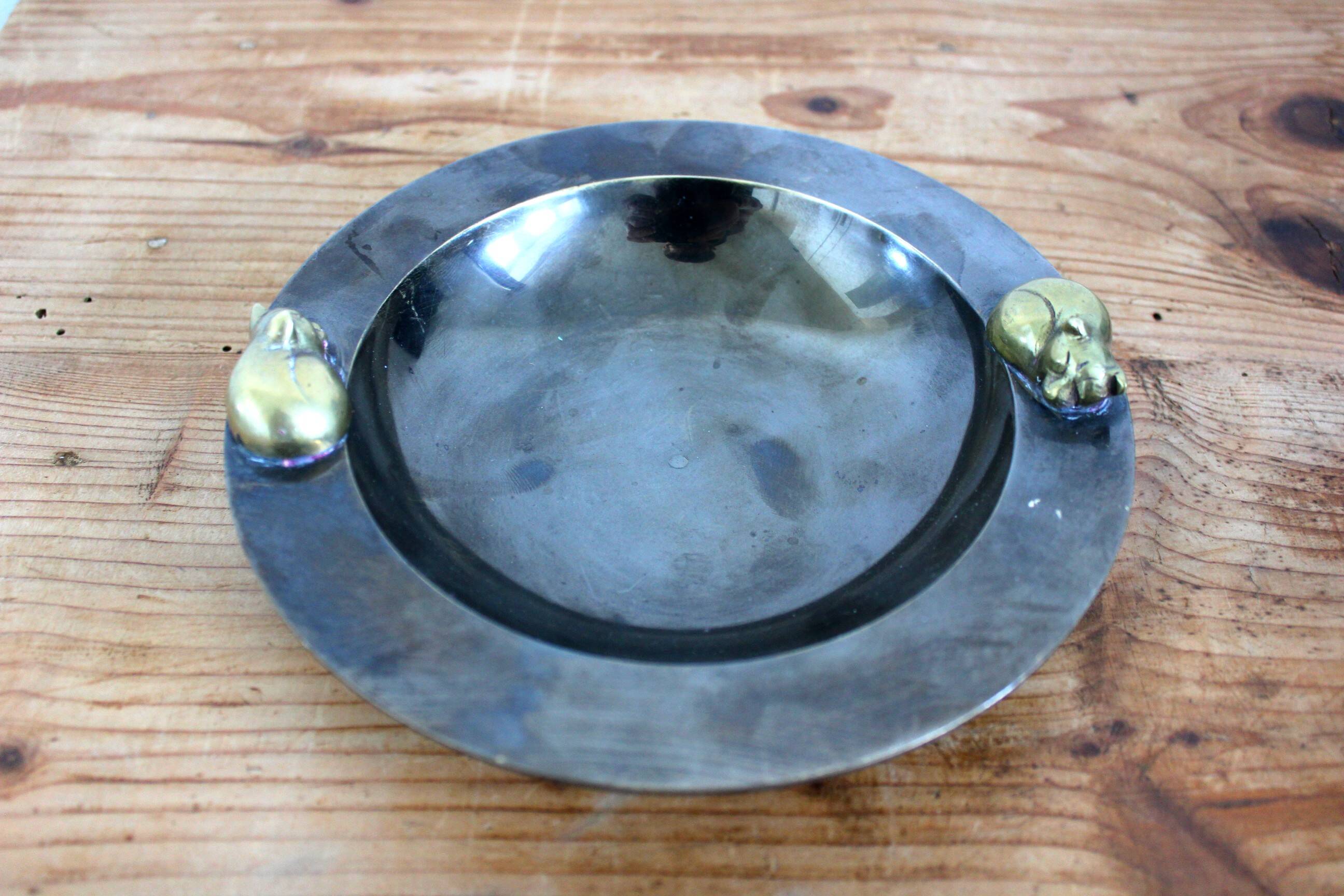 2 antique round serving trays with bronze handles and chrome finish.