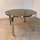 Table ronde vintage tubulaire en métal et verre fumé design année 70