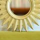 Vintage gold-colored sunburst mirror