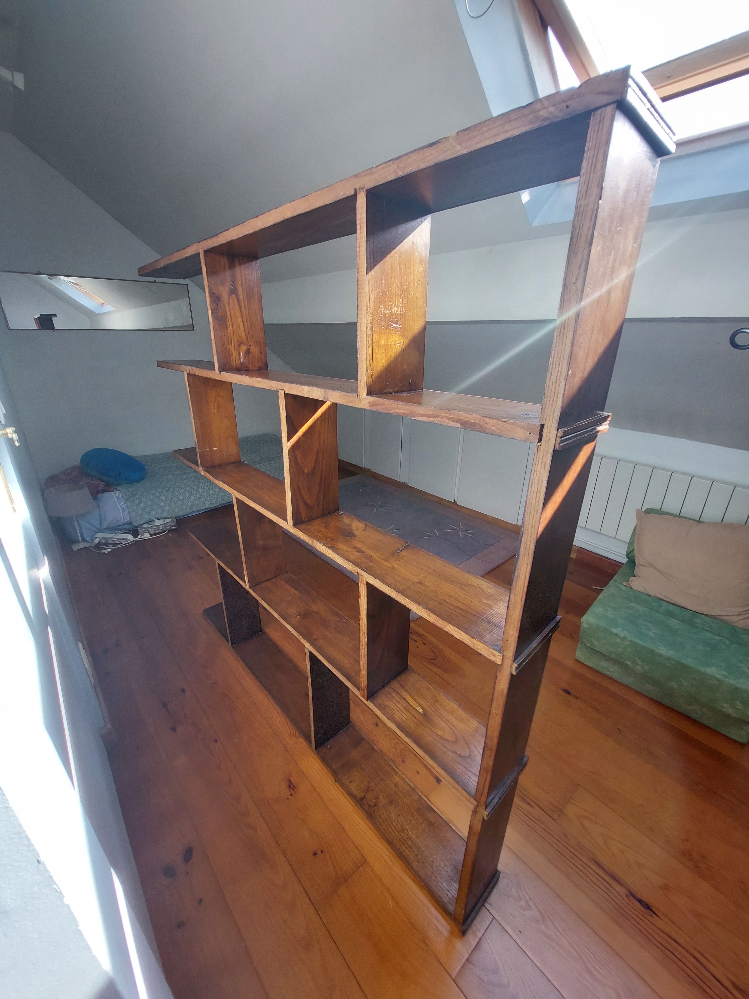 Asymmetrical wall or divider bookcase in dark wood